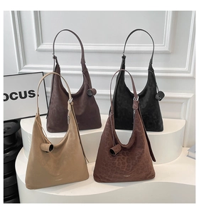 Four large minimalist tote bags in beige, brown, black and leopard print on a display