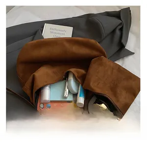 Brown faux suede tote bag interior showing large capacity for laptop and cosmetics