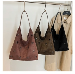 Detailed laser-cut floral pattern on high-quality suede tote bags in three colors