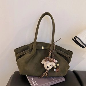 Dark green faux suede tote bag with leopard puppy charm and sleek shoulder straps