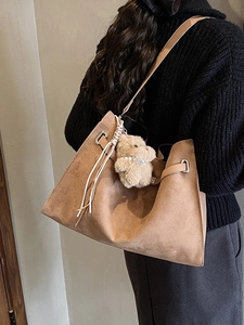 Retro brown oversized tote bag in matte suede leather with cute plush bear charm decoration