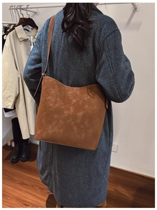Close-up of the vintage brown hobo bag featuring matte faux suede texture and a large capacity