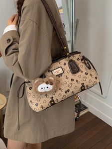 Vintage patterned tote bag in beige with brown straps and a plush cat pendant
