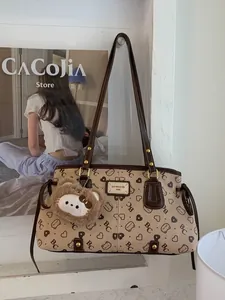 Retro beige tote bag with BC monogram print and brown leather handles on display