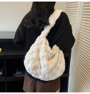Detail view of white plush hobo bag showing its large capacity and checkerboard texture
