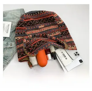 Detail shot showing large capacity of the ethnic wool tote bag with daily essentials