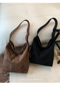 Close-up of retro large-capacity suede hobo tote bags in brown and black colors