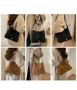 Detail shots of retro suede bucket bag in black and brown with golden metal buckle