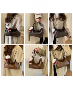 Detailed views of vintage hobo bag in dark coffee and caramel with a plush bear charm