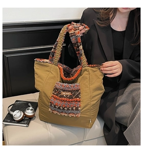 Detail of khaki tote bag with colorful faux shearling pocket and leather label
