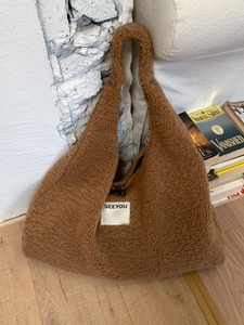 Brown fuzzy faux shearling tote bag with SEEYOU label and soft fleece shoulder strap