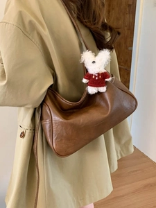 Brown vintage leather Hobo shoulder bag with a cute white plush bunny charm