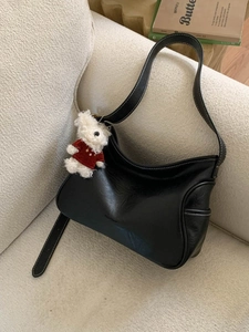 Black leather hobo bag with contrast white stitching and cute plush bear charm