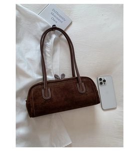 Deep brown suede Boston bag detail with white contrast stitching and double zipper close