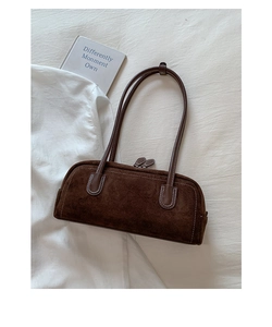 Detail of dark brown suede Boston bag with contrast stitching and double shoulder straps