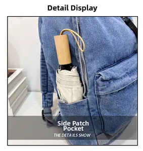 Detail view of denim backpack side pocket showing a folding umbrella storage capacity