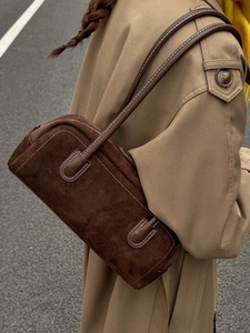 Brown suede Boston shoulder bag with contrast stitching and retro bowling silhouette