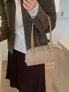 Retro beige suede Boston handbag with minimalist top handles and zipper closure