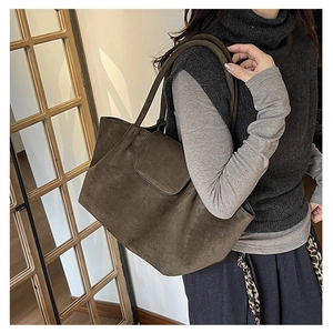 Brown suede tote bag shown on a model for a vintage daily commuting and stylish look