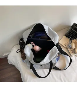 Top view of spacious multi-pocket tote bag interior with laptop and daily essentials