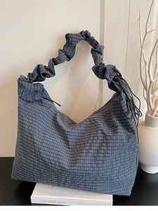 Blue checkered canvas tote bag with ruched handle and drawstring for casual daily use