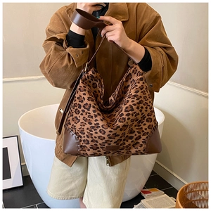 Close-up of leopard print tote bag featuring premium suede stitching and handcrafted seams