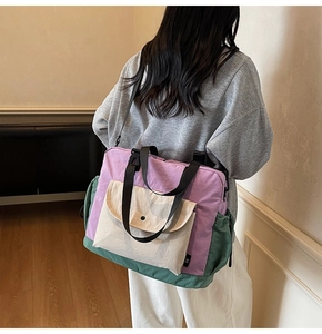 Detailed side view of a multi-color nylon tote bag featuring purple and green paneling