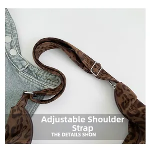 Detail of adjustable leopard print shoulder strap with high-quality silver metal buckle