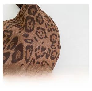 Close-up of leopard print textured fabric and black zipper on the vintage crossbody bag