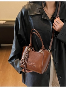 Retro brown bucket handbag with top handles and adjustable strap for women in 2026