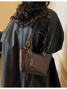 Retro dark brown PU leather bucket bag with XQ GEOR embossing and metal abacus charm