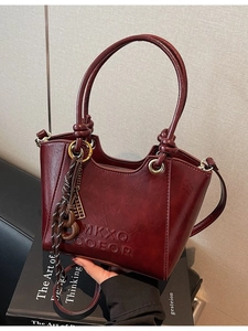 Retro burgundy frosted tote bag with textured finish and adjustable shoulder strap