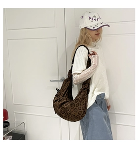 Detail of vintage leopard print hobo bag showing soft texture and large capacity