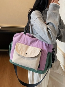 Minimalist color-block shoulder bag in purple and beige with adjustable wide strap