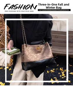 Detail of hobo bag with quilted leather texture, gold chain strap, and autumn background