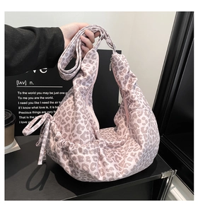 Detail of pink leopard print hobo bag with adjustable drawstring and large capacity