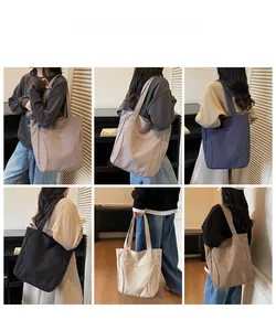 Canvas tote bag selection in multiple colors with minimalist design and shoulder straps