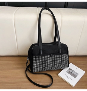 Detail of black contrast tote with silver rhinestones and mixed leather texture