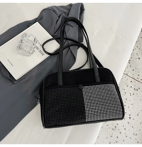 Detail of checkered rhinestone pattern on black shoulder bag with a premium matte texture