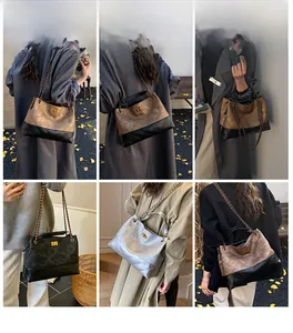 Macro view of vintage quilted chain tote bag with metallic hardware and sleek finish