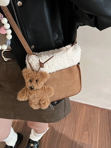 Brown fuzzy crossbody bag with white fleece trim and cute teddy bear charm for winter