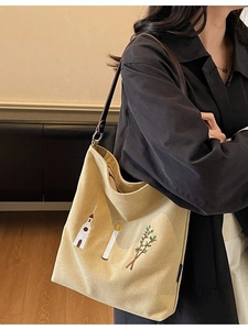 Vintage embroidered canvas tote bag with brown leather strap and intricate church patterns