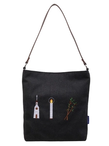 Vintage black canvas tote bag featuring floral embroidery and brown faux leather strap
