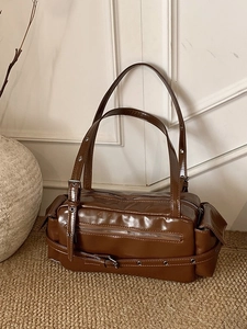 Vintage caramel patent leather Boston shoulder bag with dual handles and metal buckles