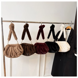Detailed view of faux fur pleated cloud bags in five autumn colors with knotted straps