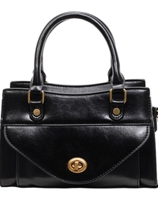 Classic black leather satchel bag with golden turn-lock closure and dual top handles