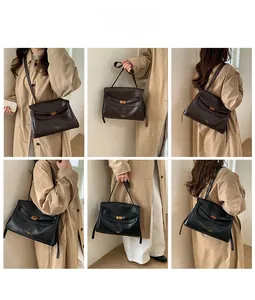 Model showing versatile ways to wear the vintage faux leather briefcase shoulder bag