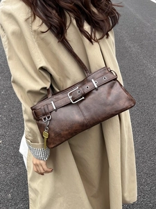 Retro brown faux leather shoulder bag with buckle detail and gold key pendant charm