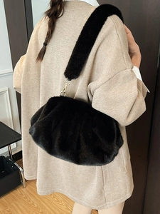 Chic black faux fur pleated cloud bag with a matching shoulder strap for winter
