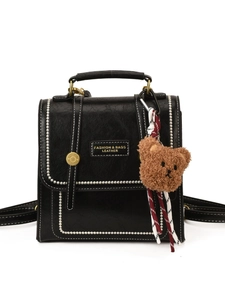 Classic black PU leather backpack with white stitching and cute bear pendant charm